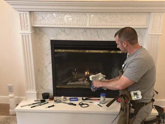 Northborough Chimney Sweep performing fireplace maintenance in Northborough, MA