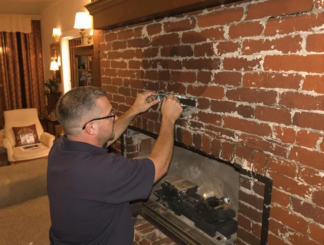 Northborough Chimney Sweep expert fixing a fireplace in Northborough, MA